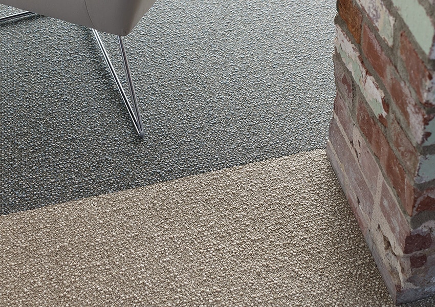 Knot It carpet around a brick section in the room