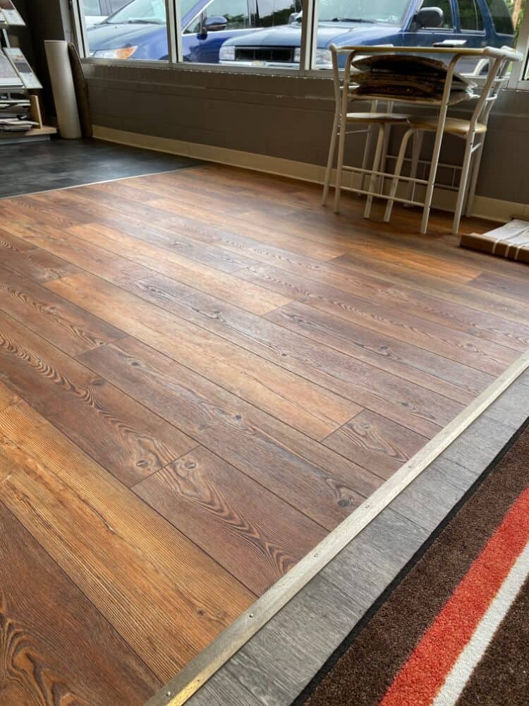 A mixture of brown flooring in a small area