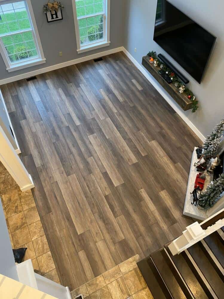 An aerial shot of the living room and the beautiful flooring in two-tone color