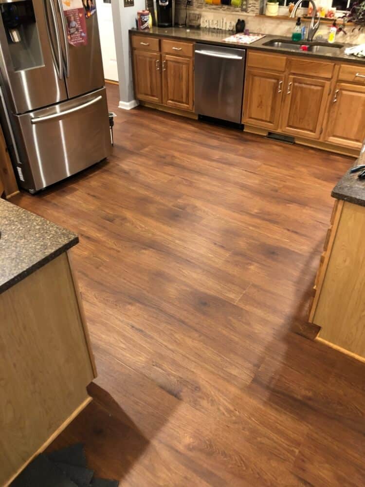 Beautiful brown-colored luxury vinyl flooring in a kitchen
