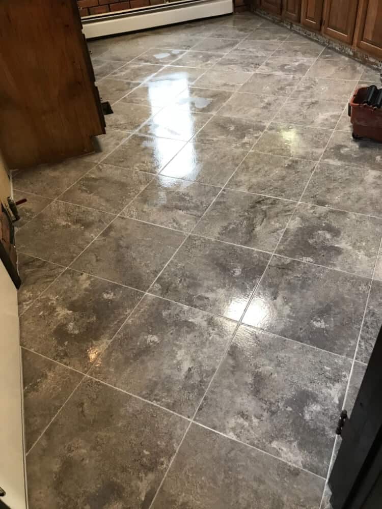 Glossy flooring in a small room with a reflection off the floor